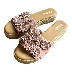 Carlos pink flower sandals with jeweled embellishments.